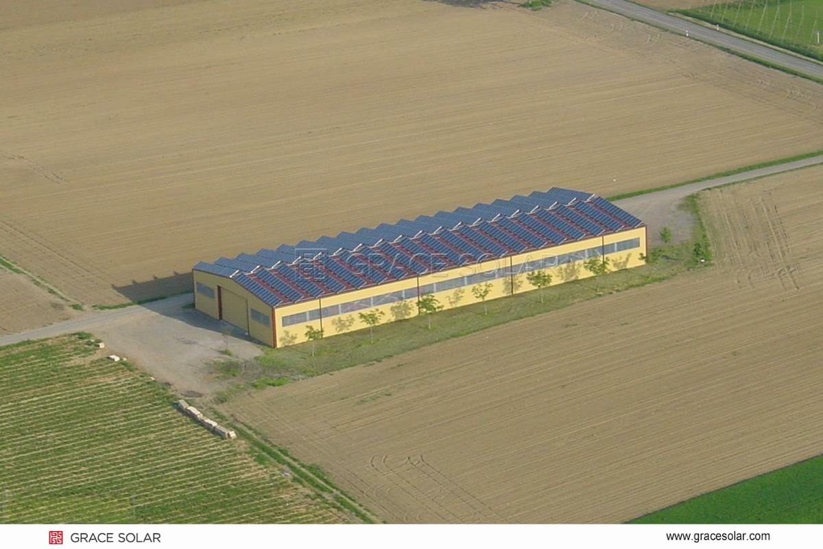 Grace Solar no-drill metal roof clamp installation on European warehouse